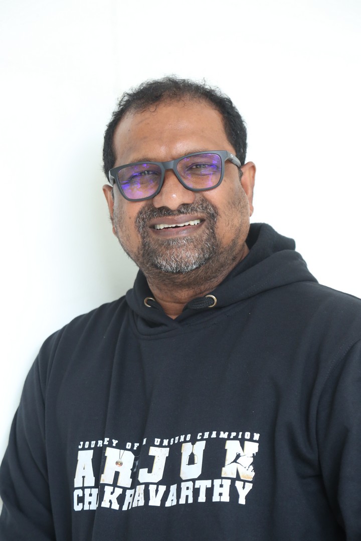 Srini Gubbala in casual black hoodie, relaxed stylish look