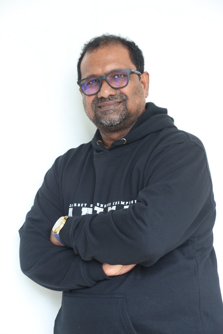 Srini Gubbala exudes effortless charm in sleek black hoodie