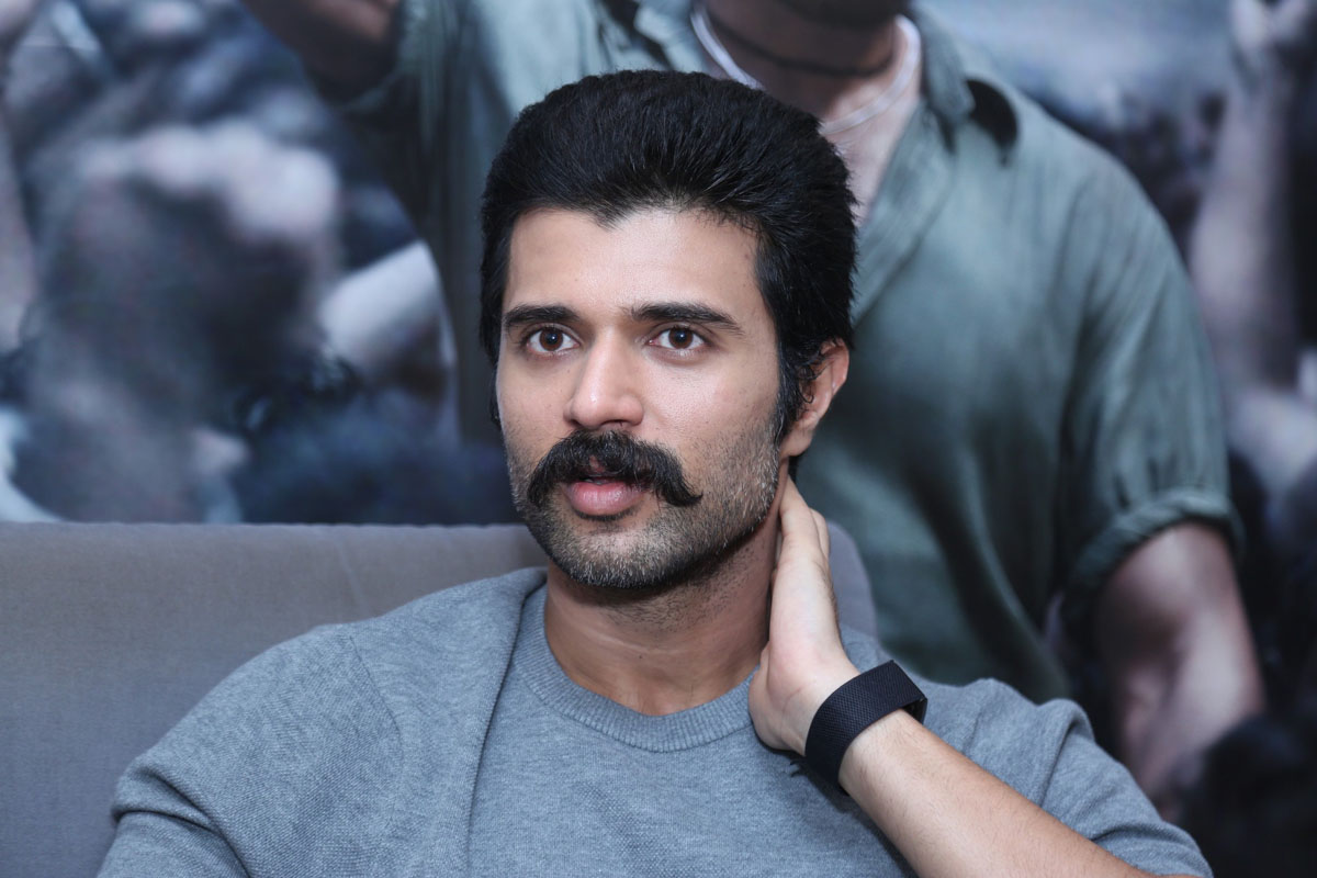 Vijay Deverakonda’s effortless style proves that even in a simple grey tee, he's ready to steal the spotlight–no face needed!