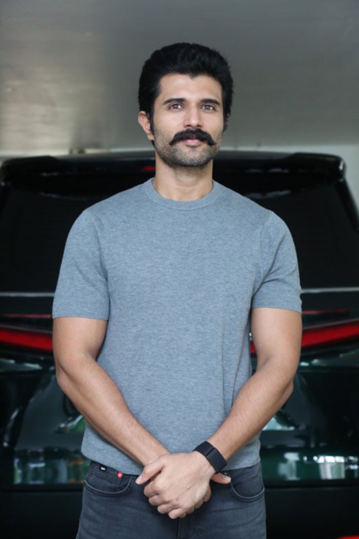 Vijay Deverakonda vibes: effortlessly stylish in a casual grey, proving that even without a face, confidence is the best accessory!