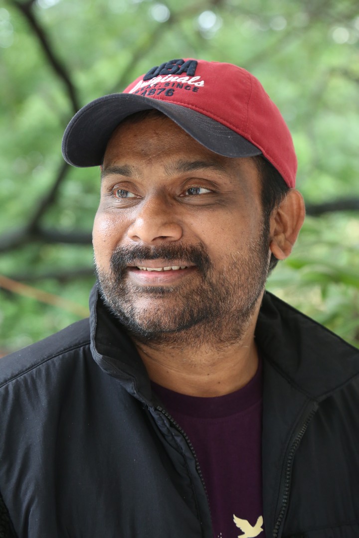 Vijay Donkada stylish in jacket and cap outdoors