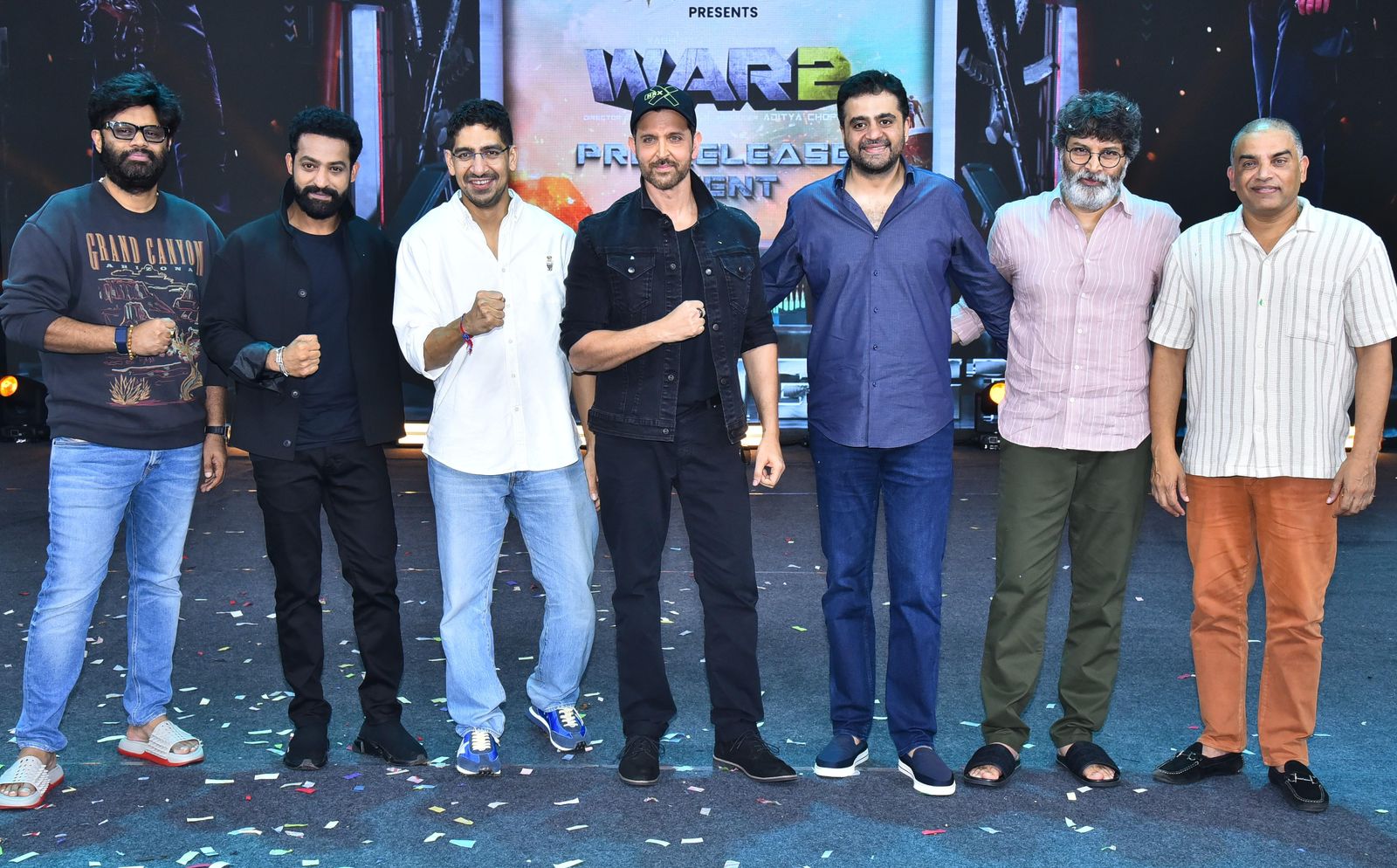 Naga Vamsi S, NTR Jr, Ayan Mukerji, Hrithik Roshan, Trivikram Srinivas, and others posing for the media
