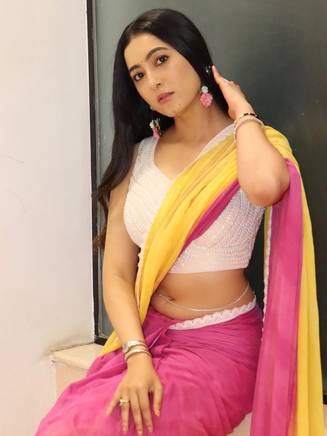 Adhvithi Shetty sizzling in vibrant yellow pink saree