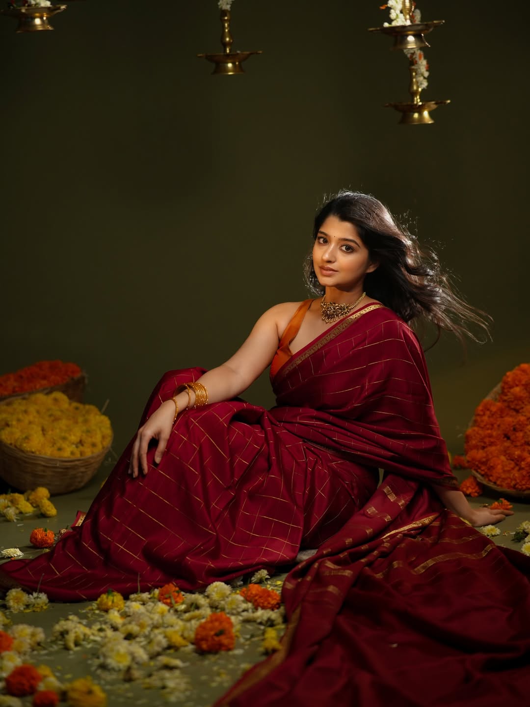 Aishani Shetty stunning in maroon saree with jewelry