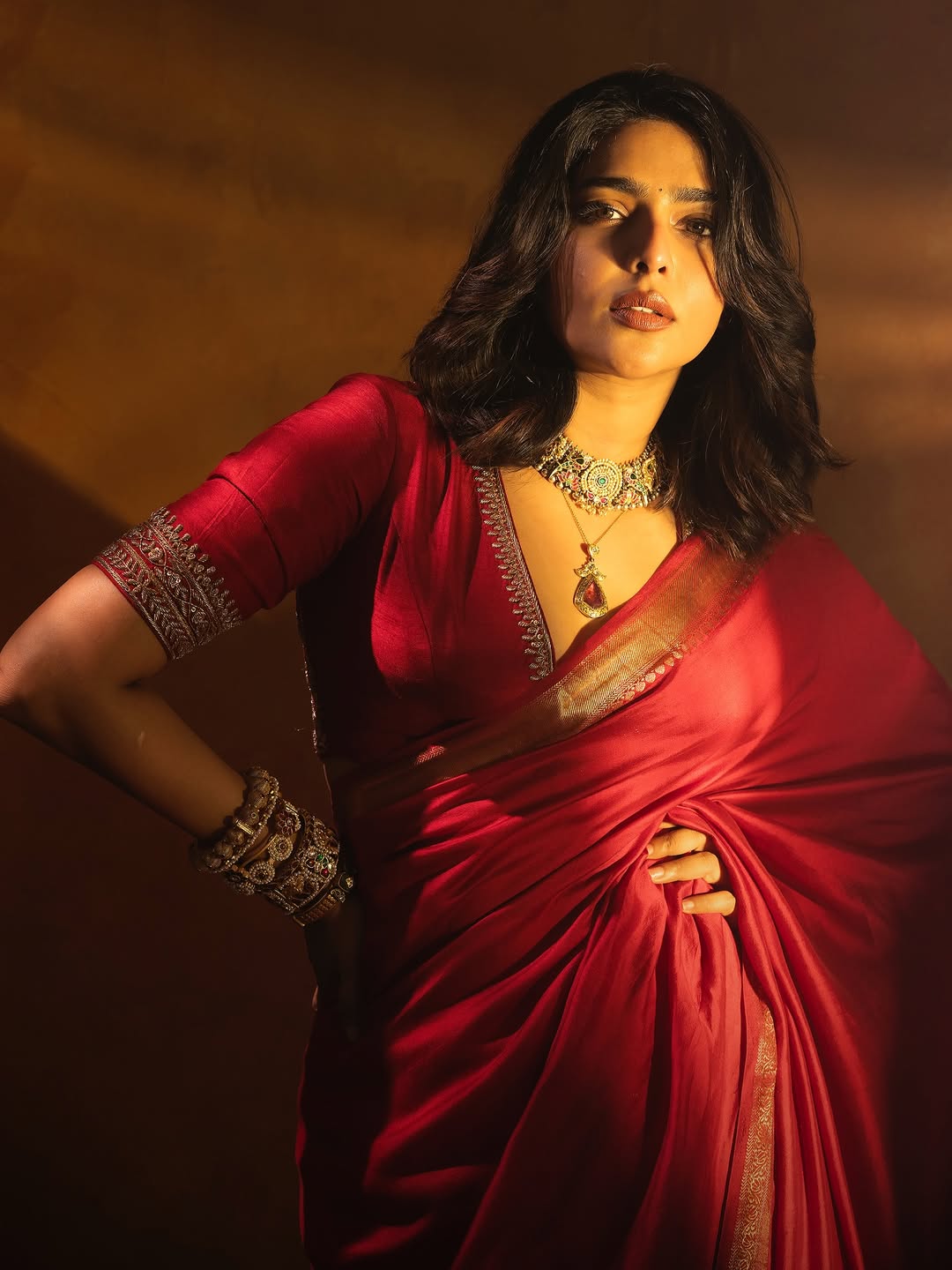 Aishwarya Lekshmi radiates elegance in stunning red saree