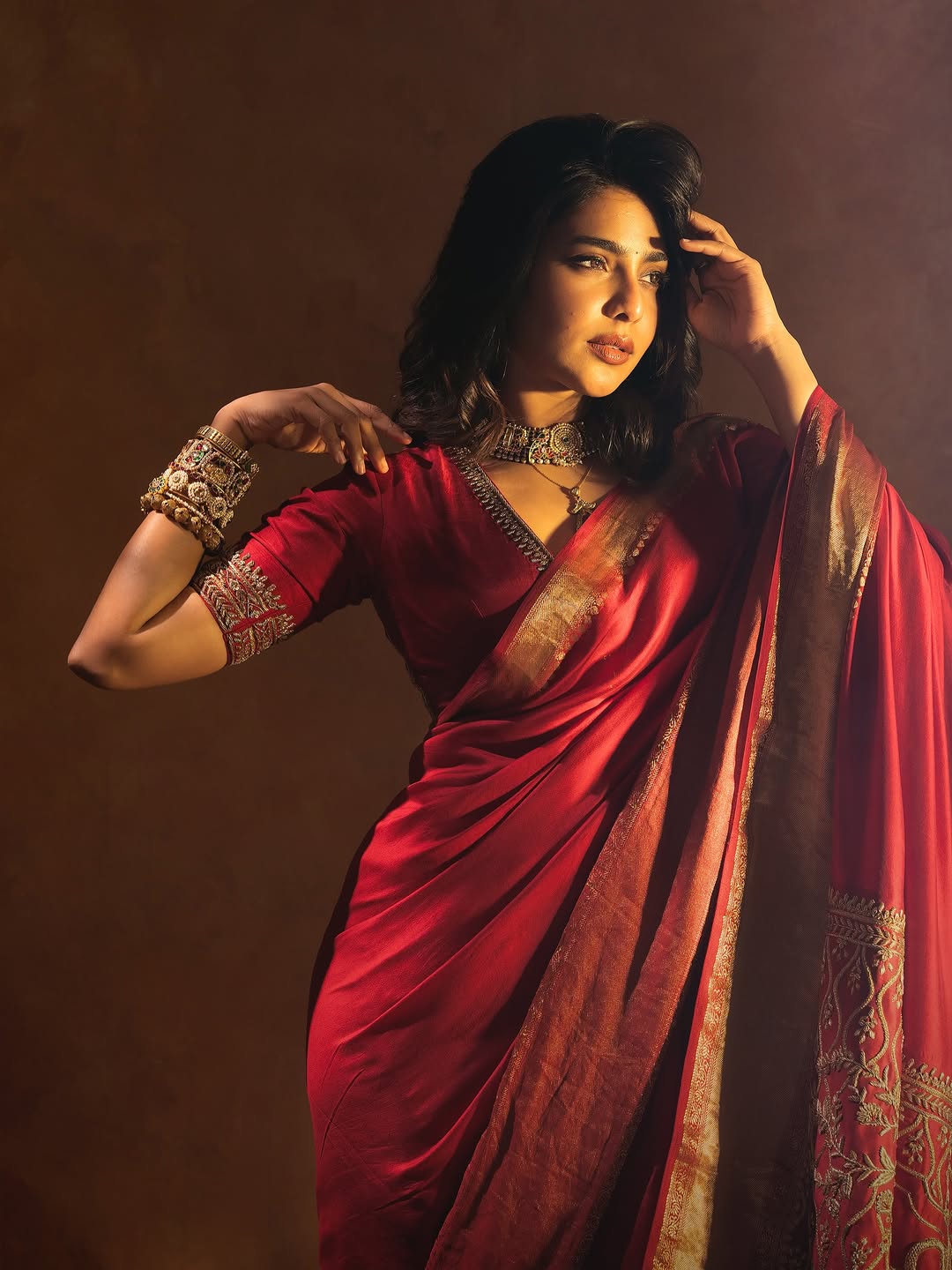 Aishwarya Lekshmi exudes grace in rich red saree