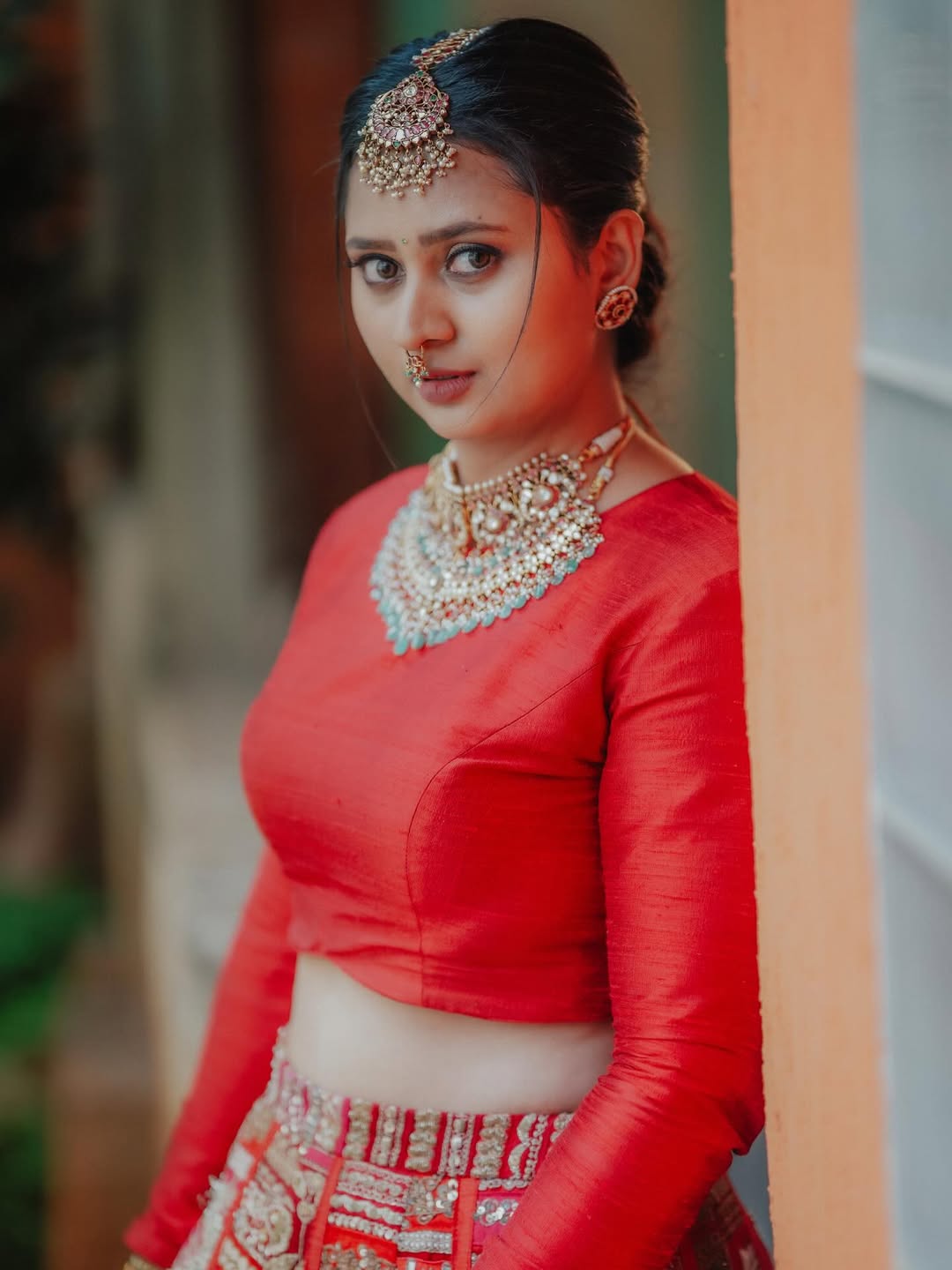 Amulya traditional elegance in red with regal jewelry