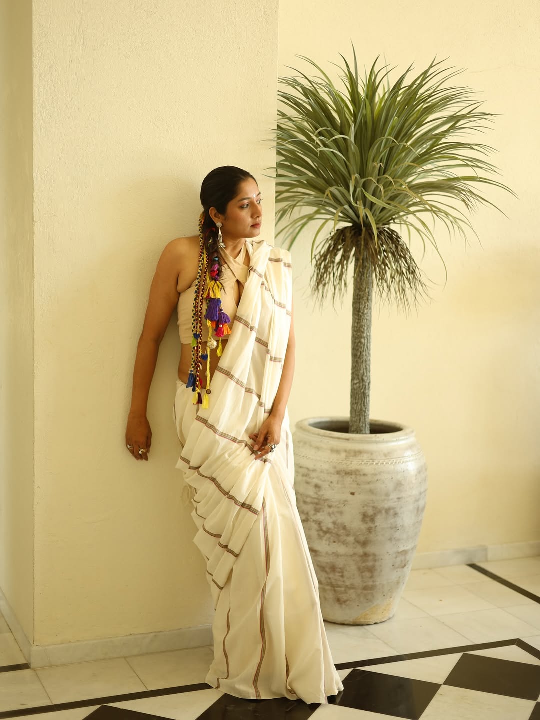 Anumol in saree with vibrant accessories and elegance