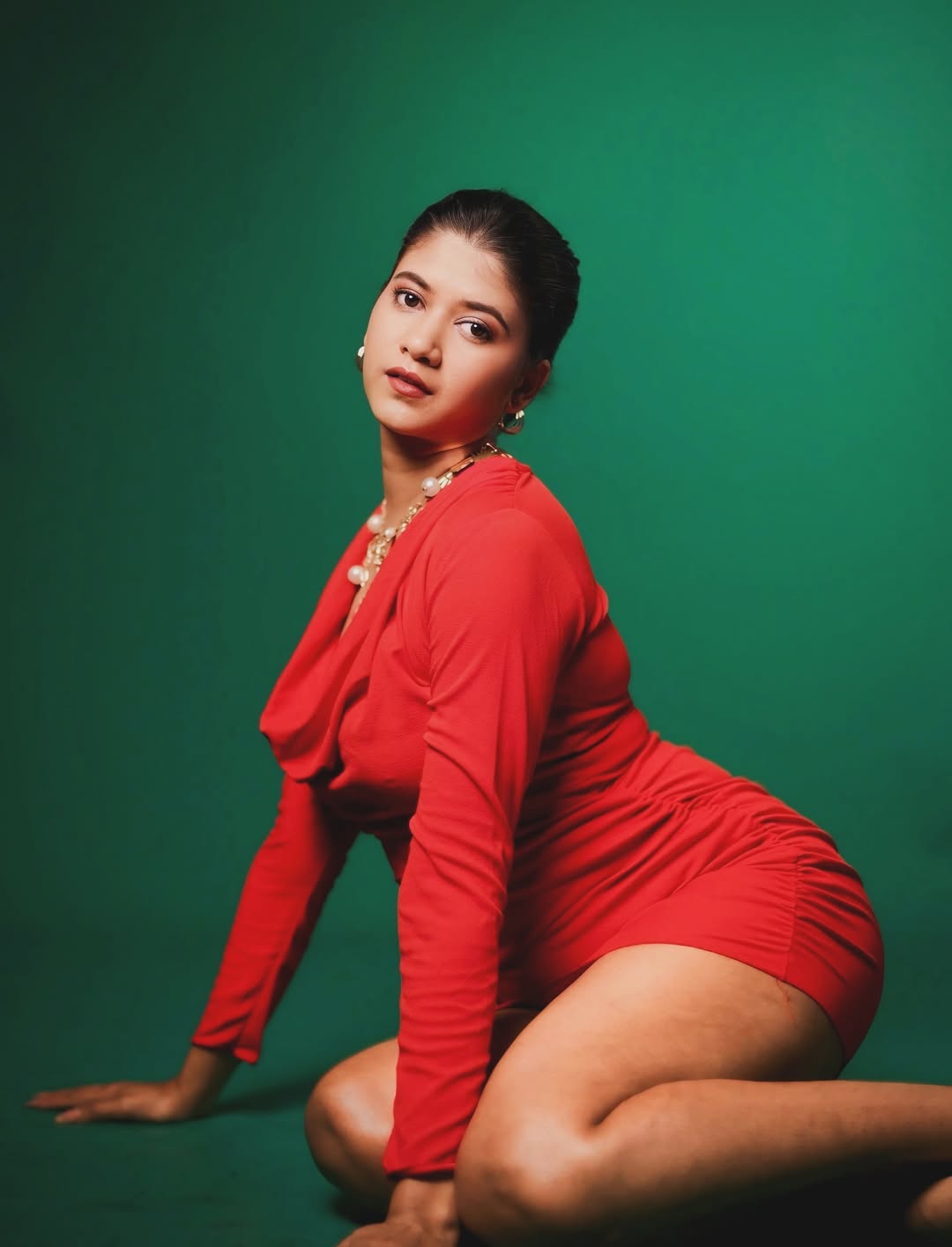 Deepika Gowda in red dress with confident pose