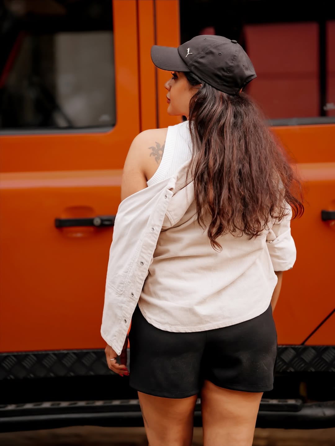 Gayathri Shan casual street style with hoodie and cap