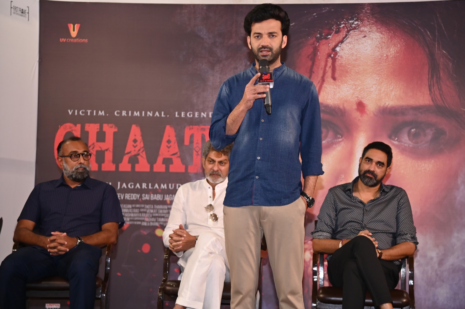 Chaitanya Rao speaking on stage at event