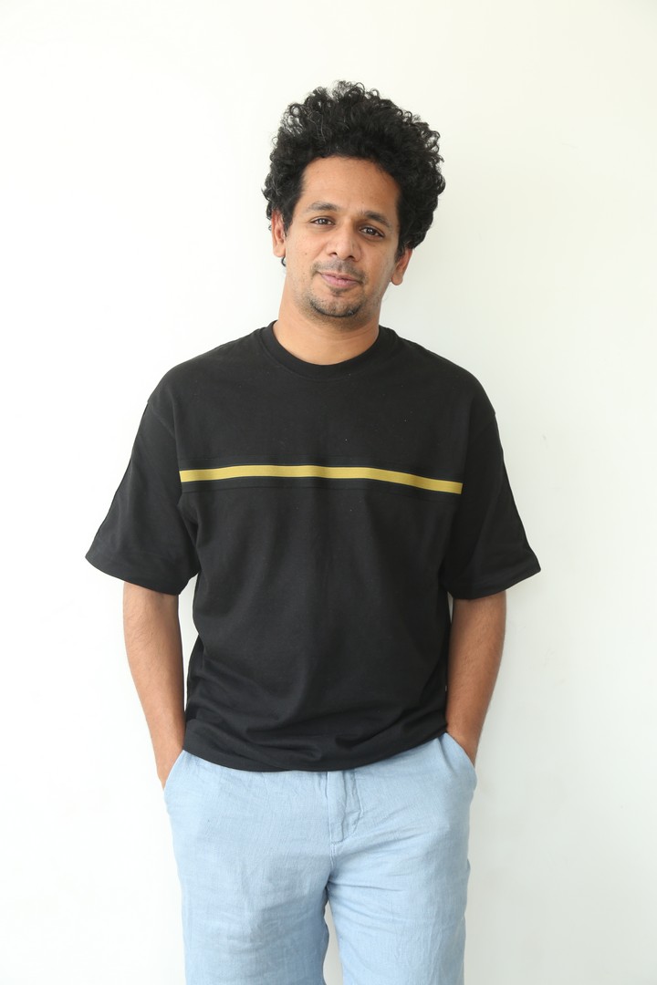 Karthik Gattamneni in black tee and blue pants fashion