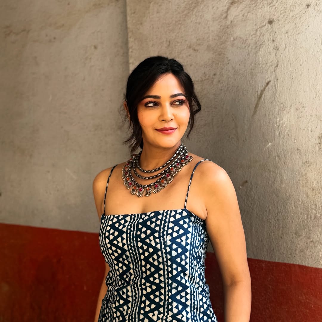 Kaveri Priyam elegant patterned dress with layered jewelry