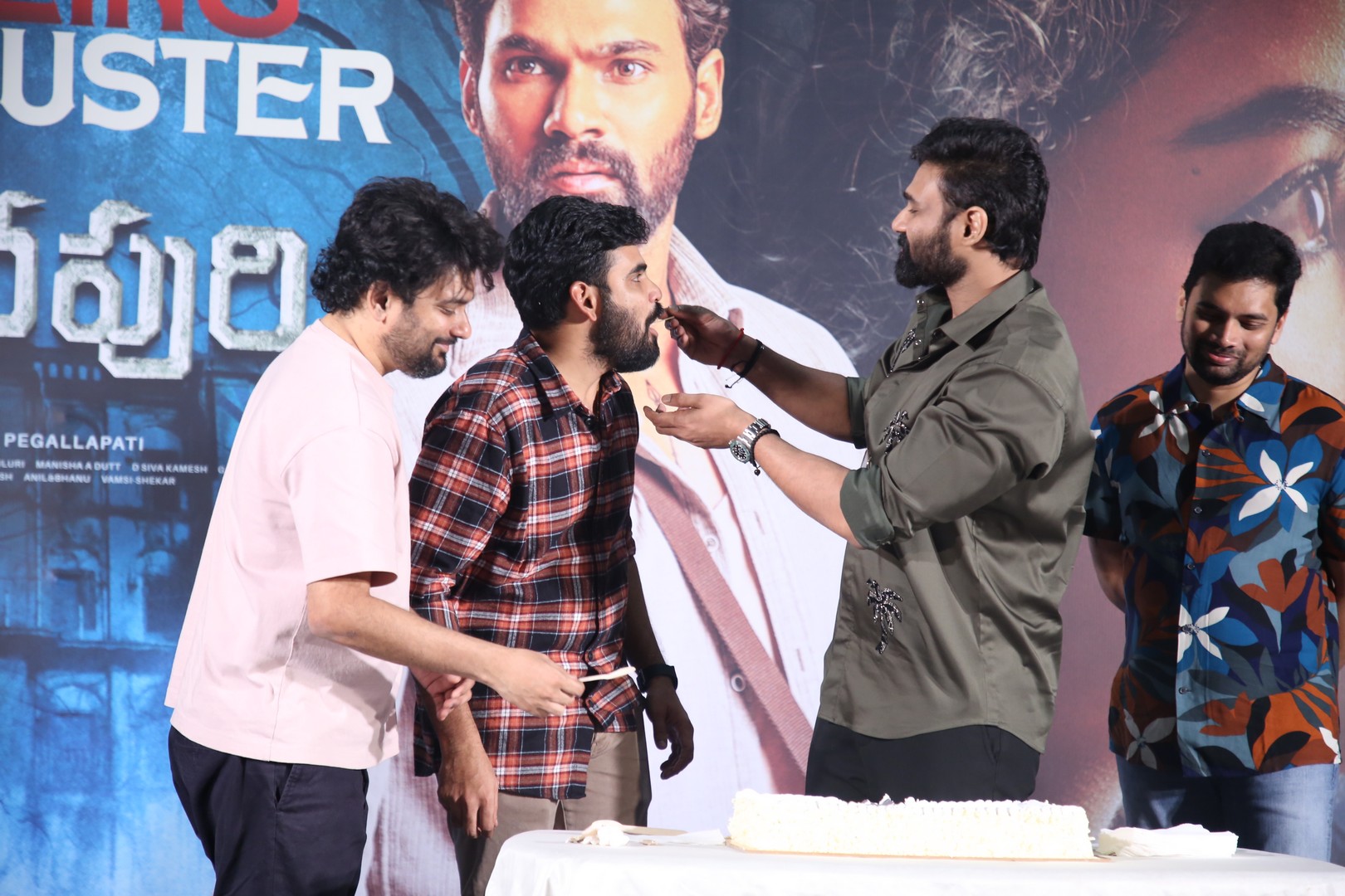 Actor feeding cake to director
