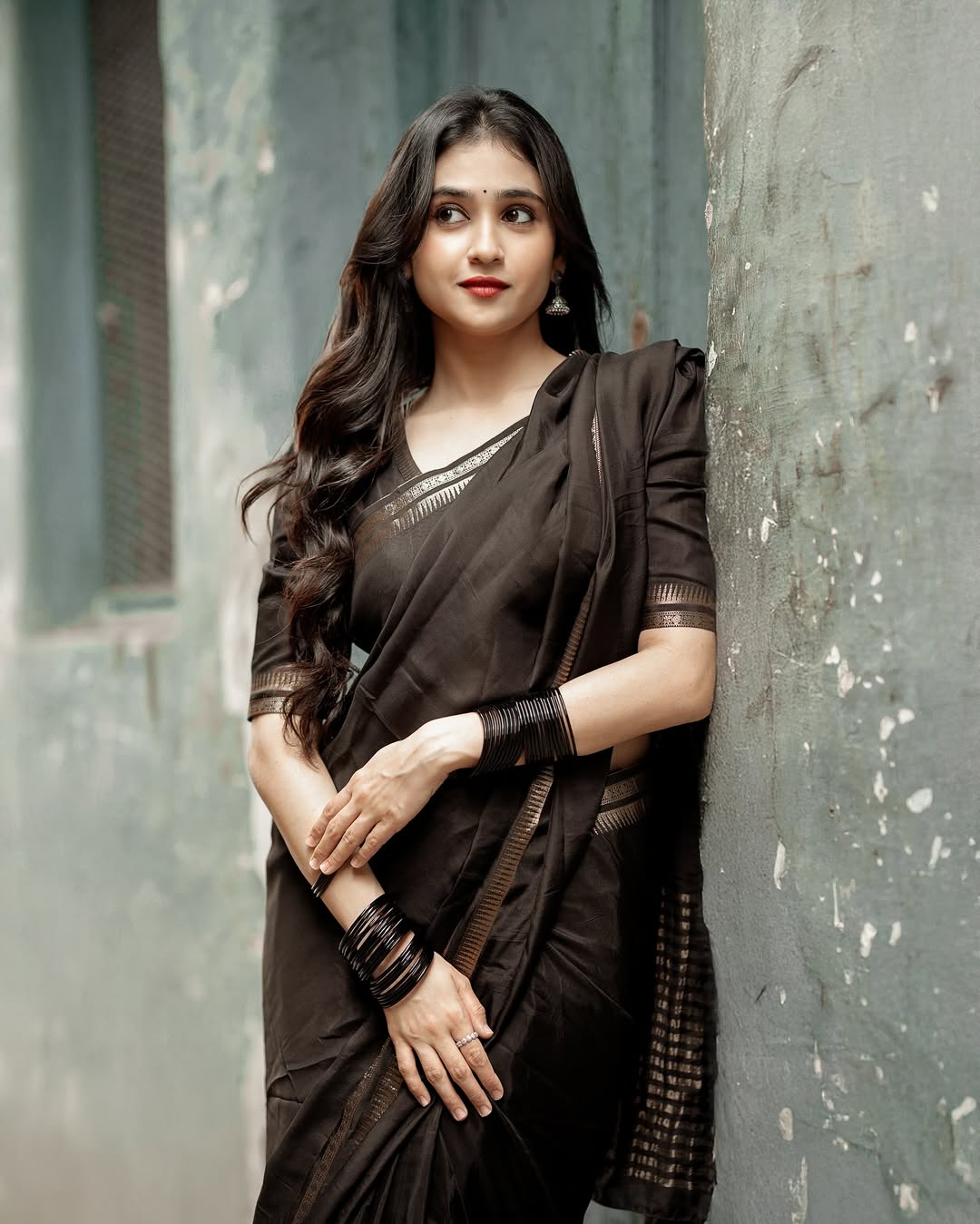 Malaika Vasupal elegant confident style in classic black