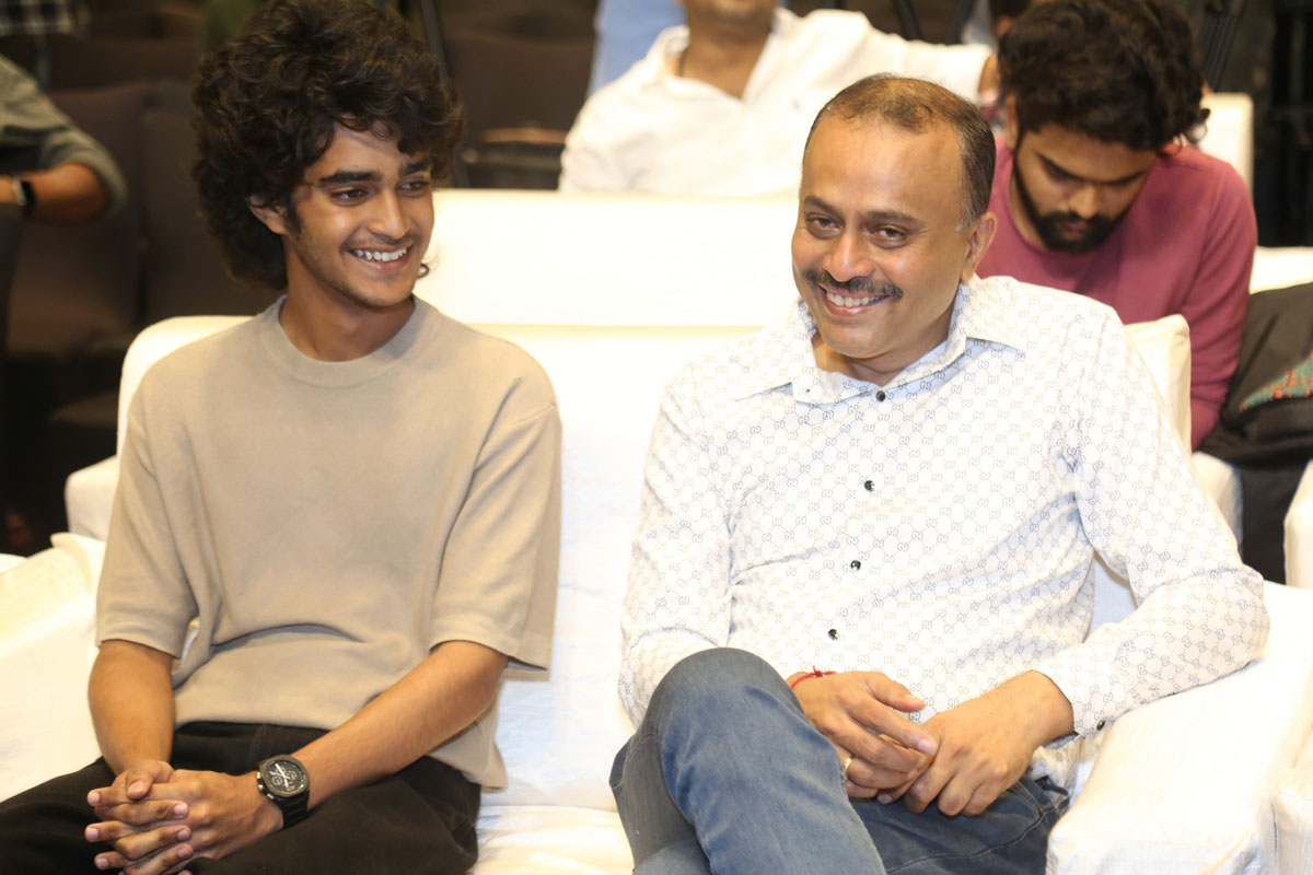 Karthikeya with TG Vishwa Prasad seated at event