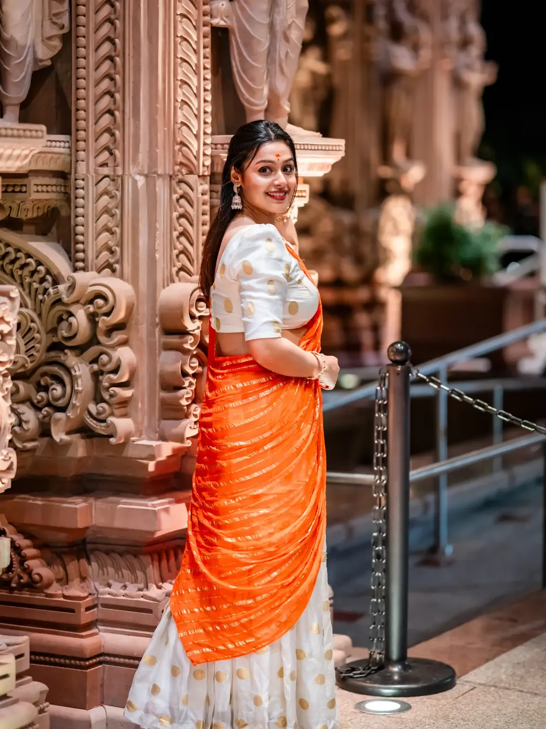 Moksha stuns in orange saree with classic elegance