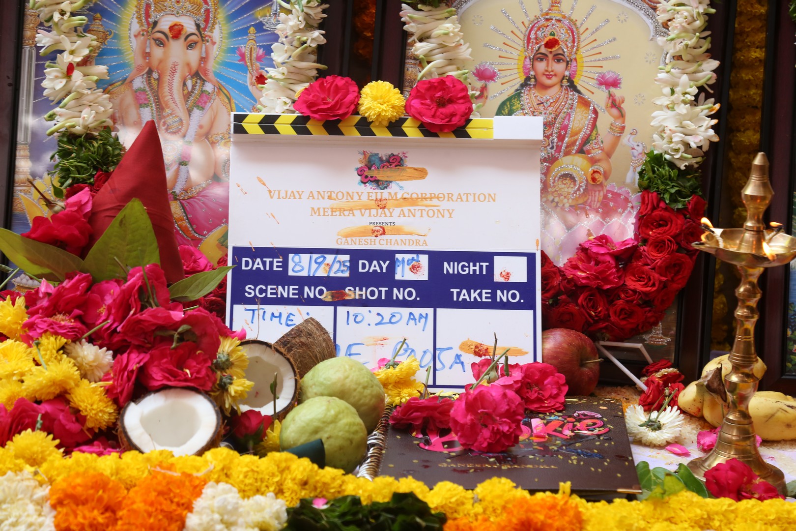 Movie clapboard dedicated to God during pooja