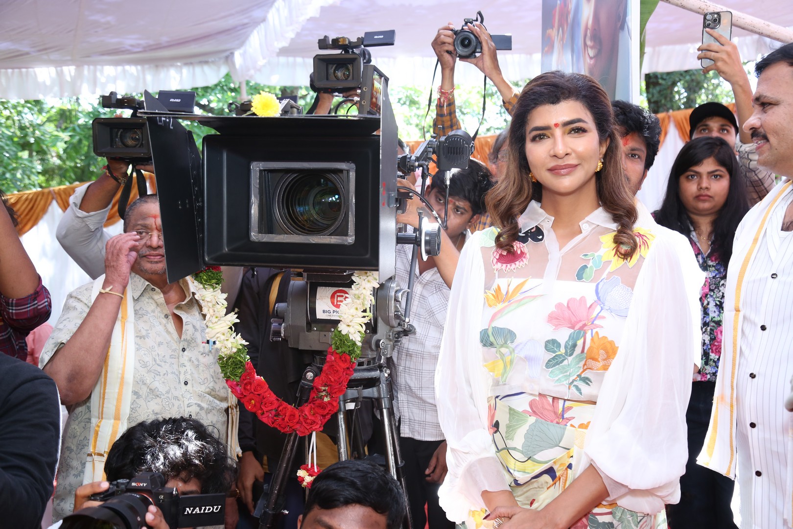 Manchu Lakshmi beside movie camera pose
