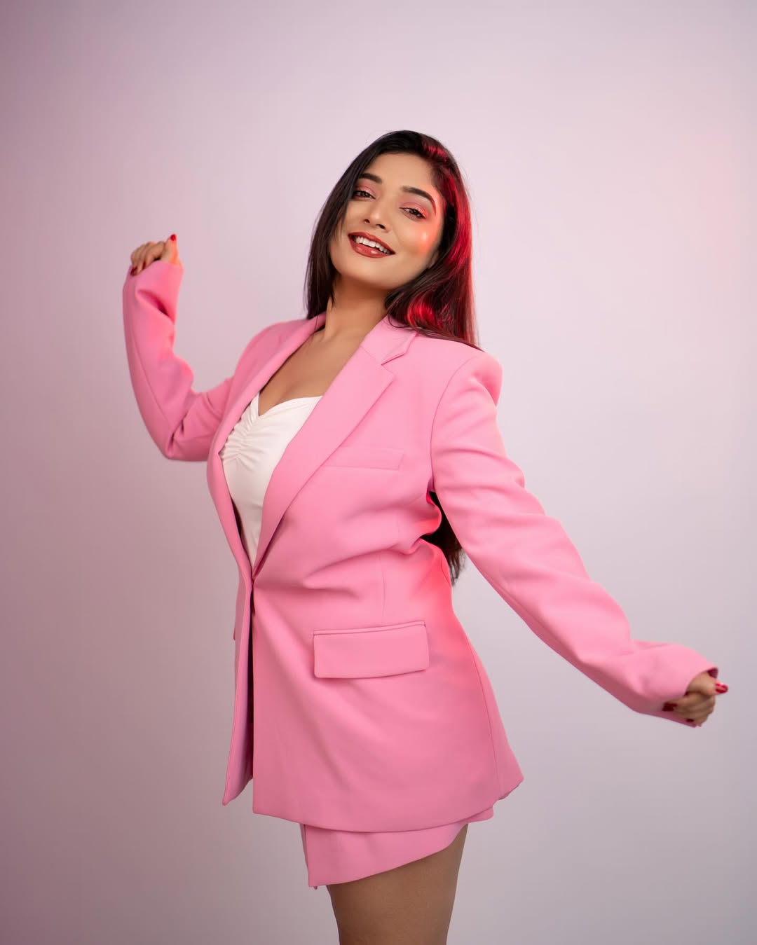 Priyanka Thimmesh playful sophistication in bold pink blazer