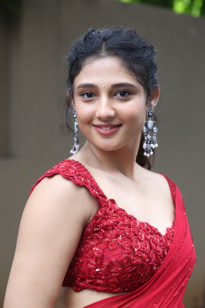 Ritika Nayak in embroidered red saree with charm