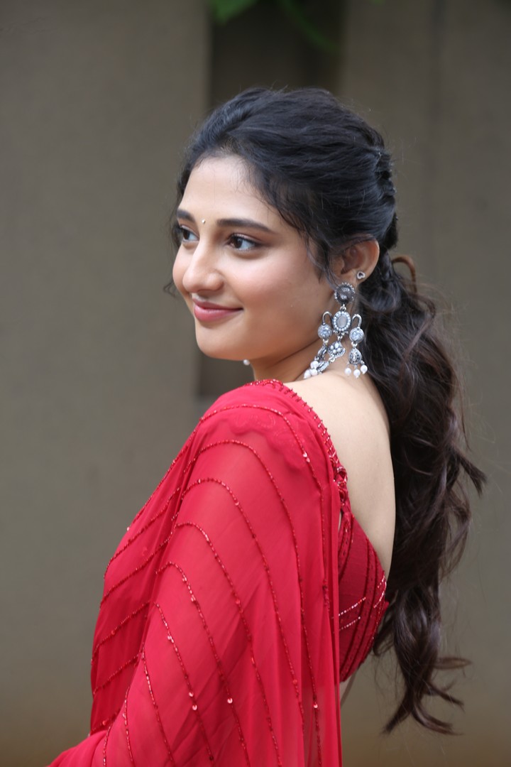 Ritika Nayak in red ensemble with sparkling elegance