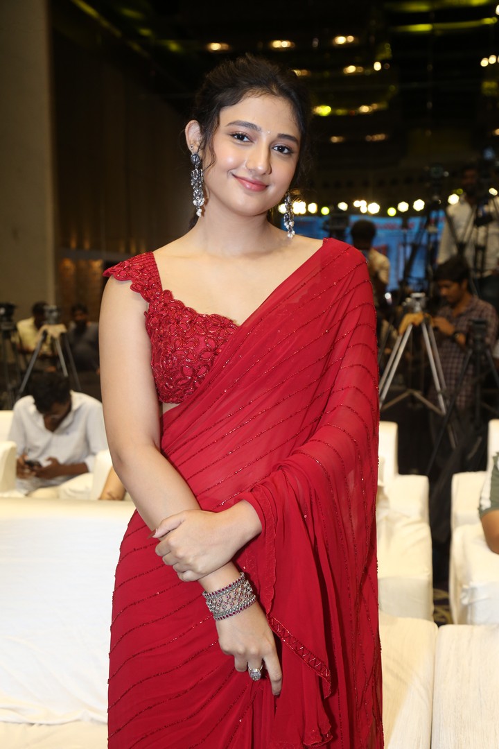 Ritika Nayak in red saree with bold accessories