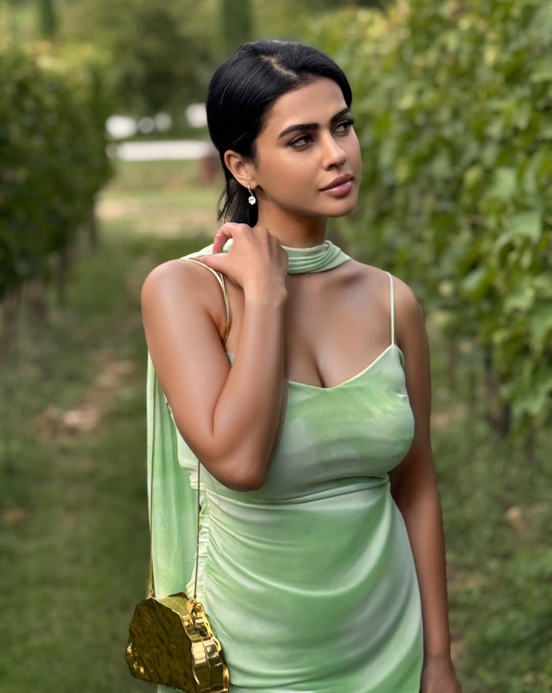 Sharmiela Mandre radiant in green satin vineyard style