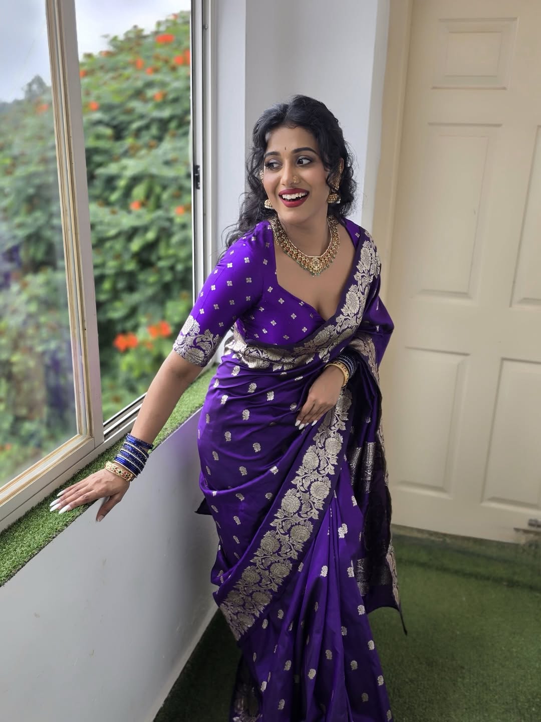 Shilpa Manjunath traditional purple saree with confident pose