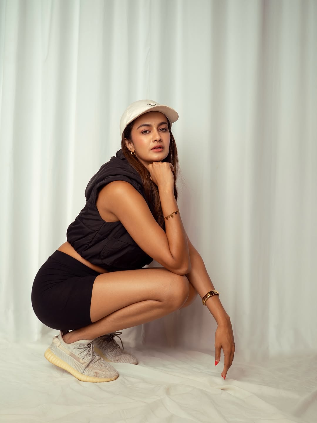 Shubra Aiyappa shows sporty chic squat as power pose