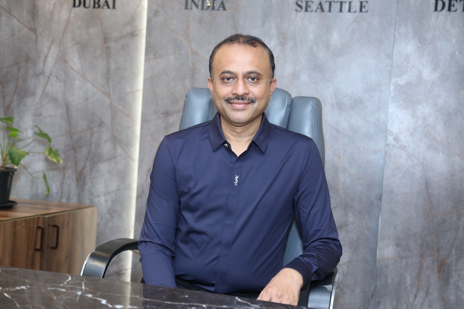 TG Vishwa Prasad exudes executive elegance in navy ensemble