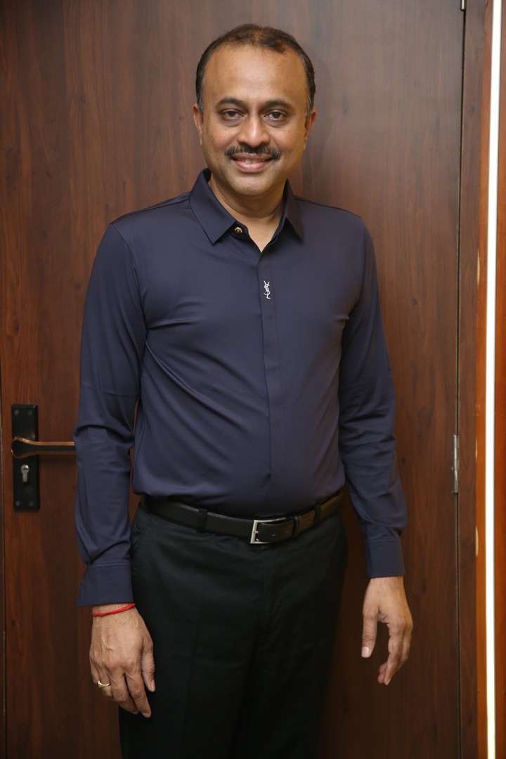 TG Vishwa Prasad poised and confident in navy business attire