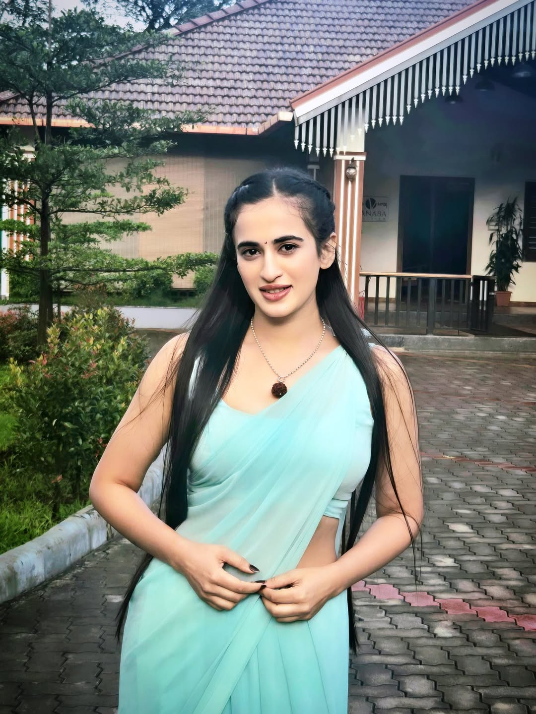 Thapaswini Poonacha elegance shines brighter than waterfall backdrop