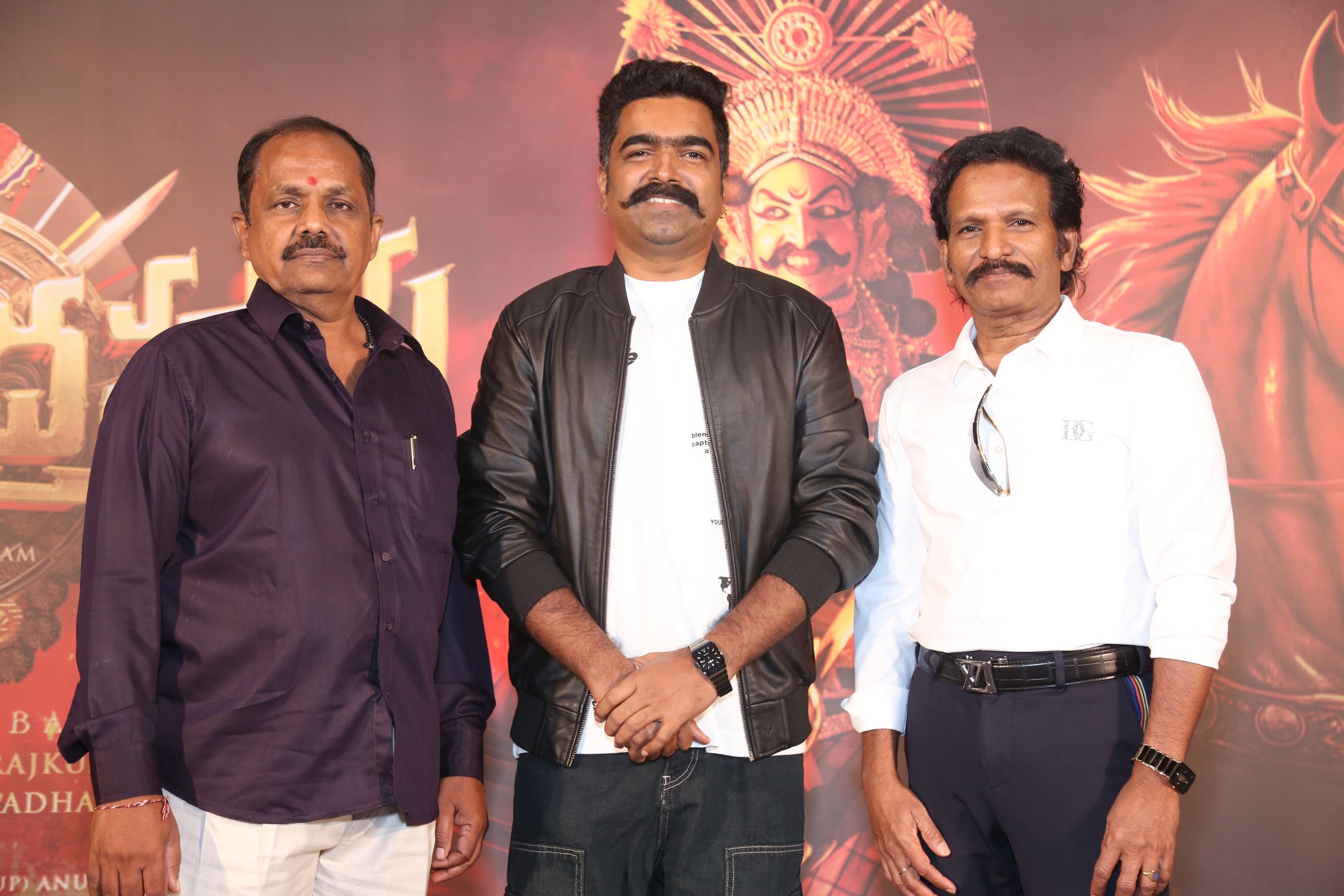Ravi Basrur with producers posing for media