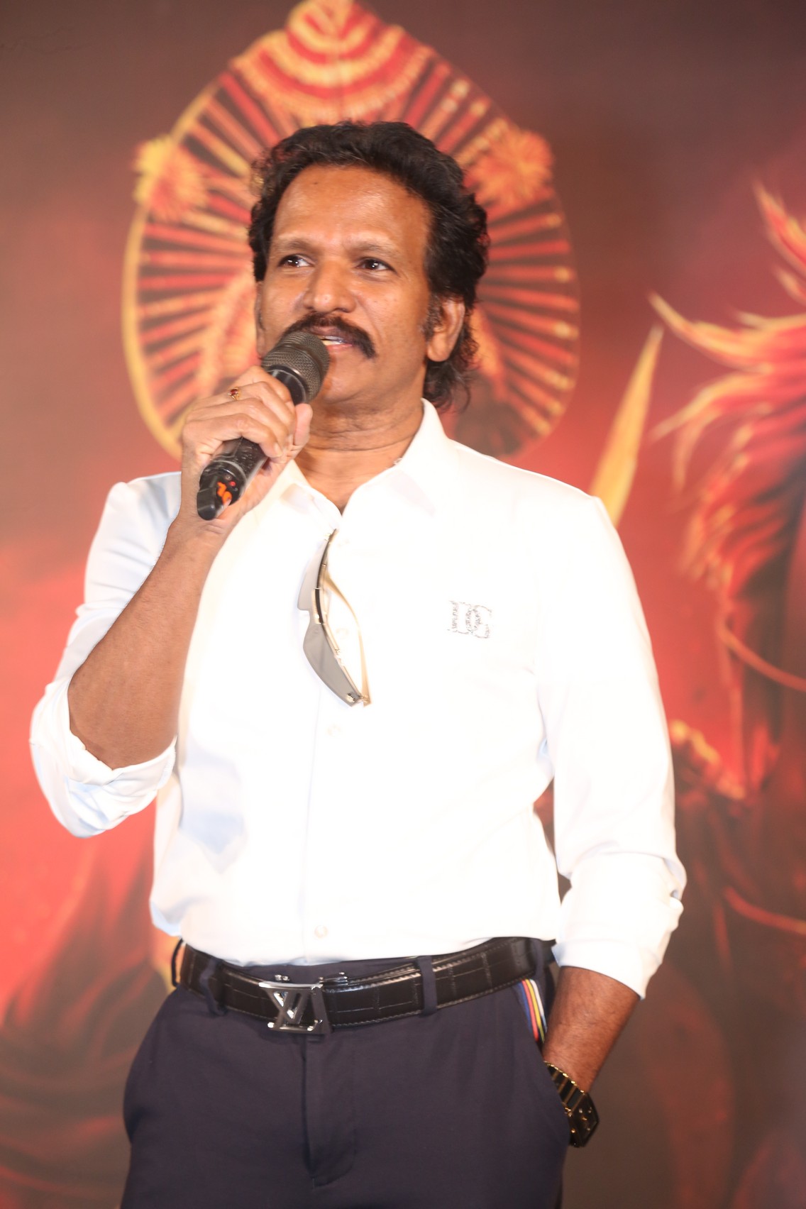 Producer James W Kommu speaking on stage