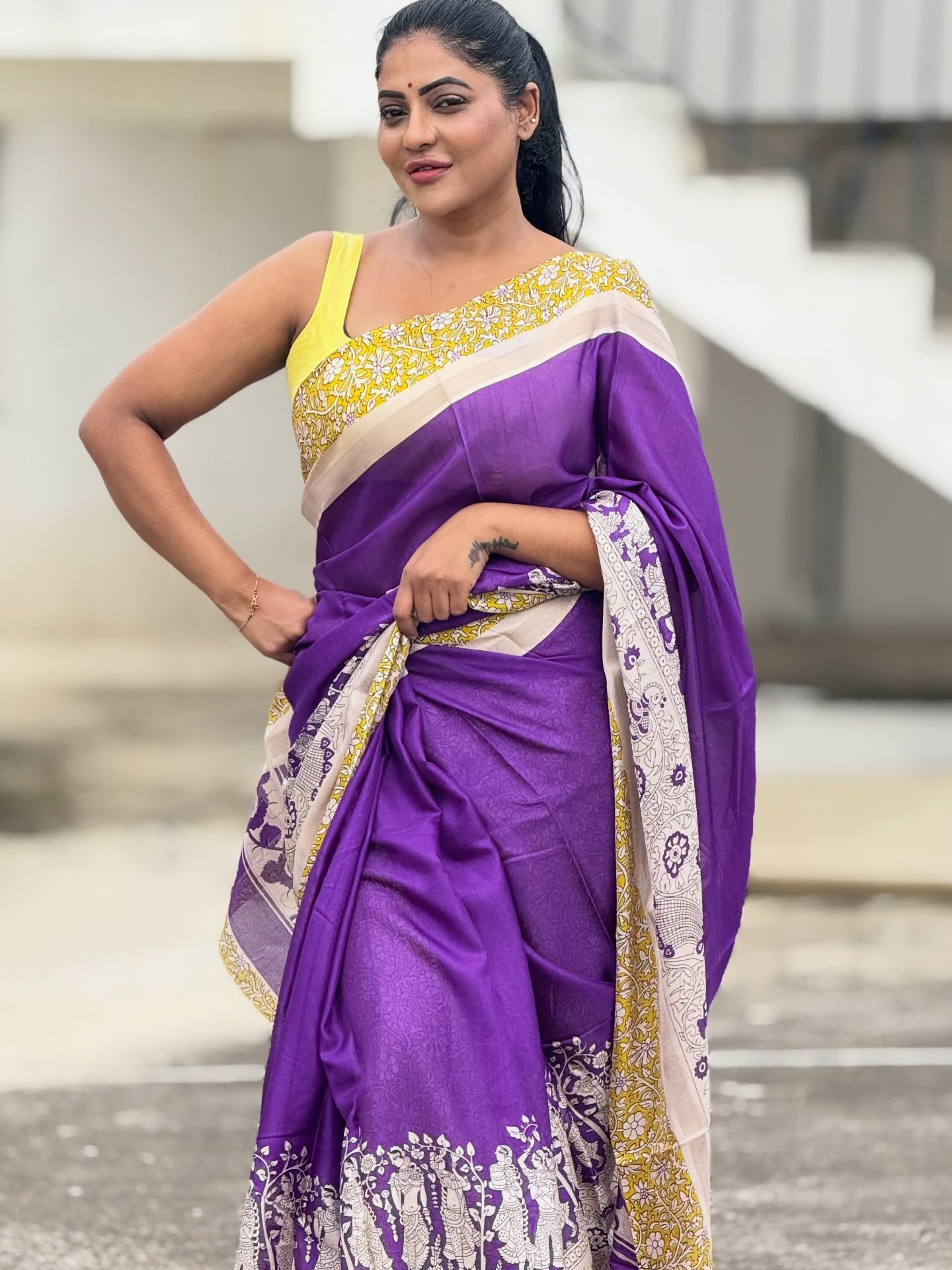 Reshma Pasupuleti makes bold purple saree runway-ready with charm