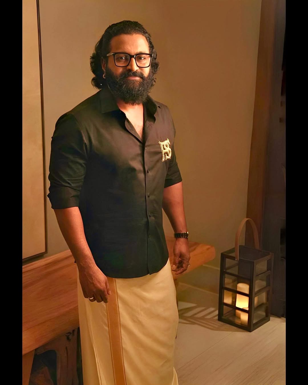 Rishab Shetty combining traditional dhoti with modern style flair