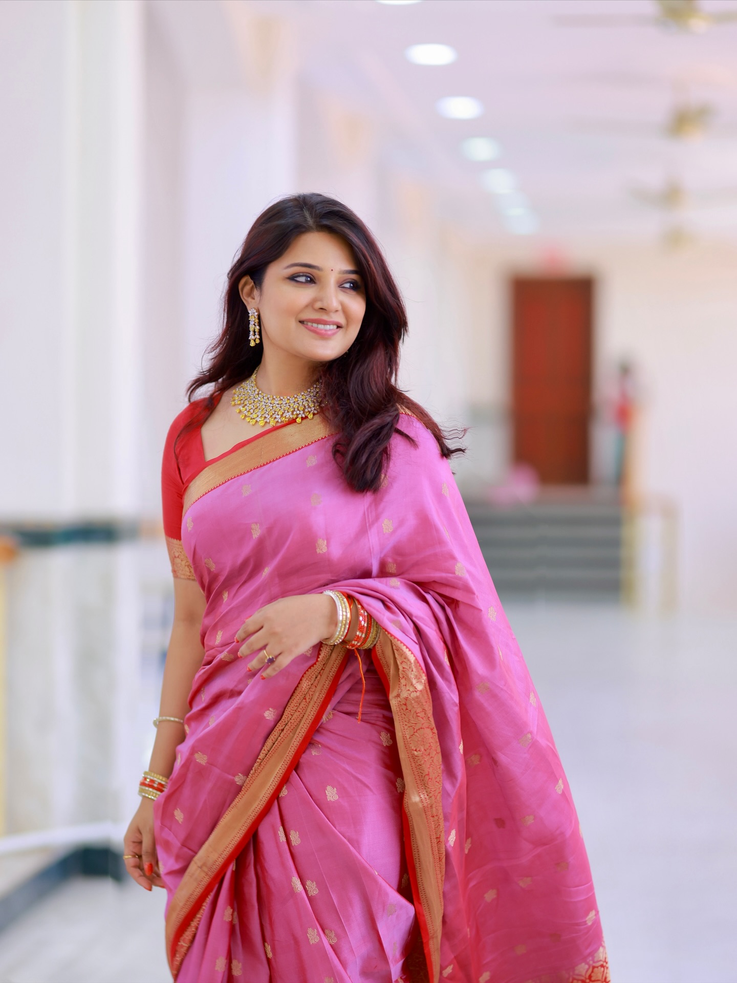 Aathmika exuding timeless elegance in pink saree with confidence