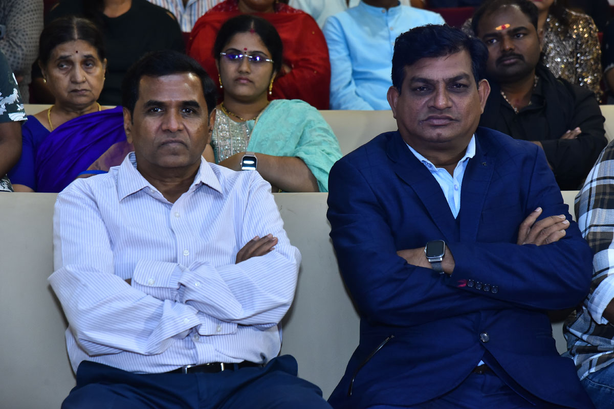 Two producers seated together during event