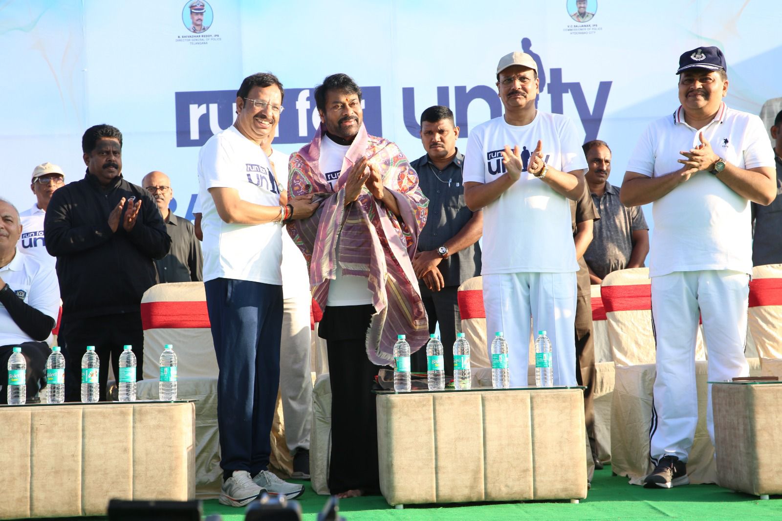Chiranjeevi receiving memento from Hyderabad Police officials