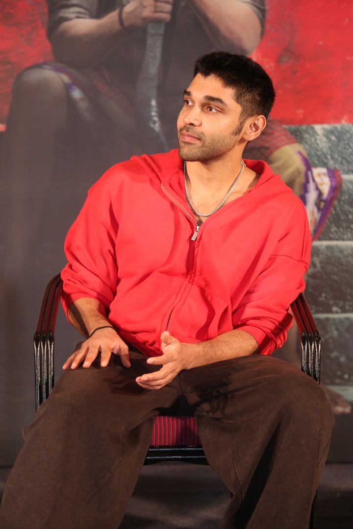 Dhruv Vikram blends casual cool with confident red hoodie