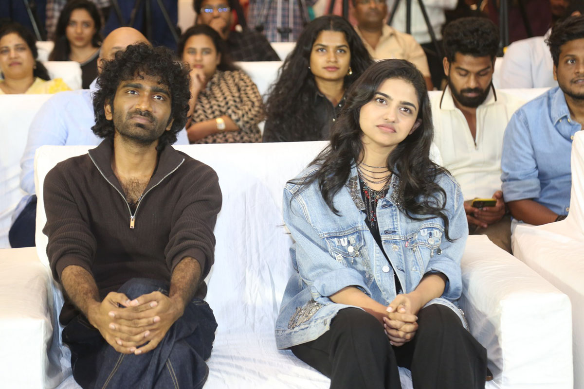 Pradeep Ranganathan Mamitha Baiju seated together