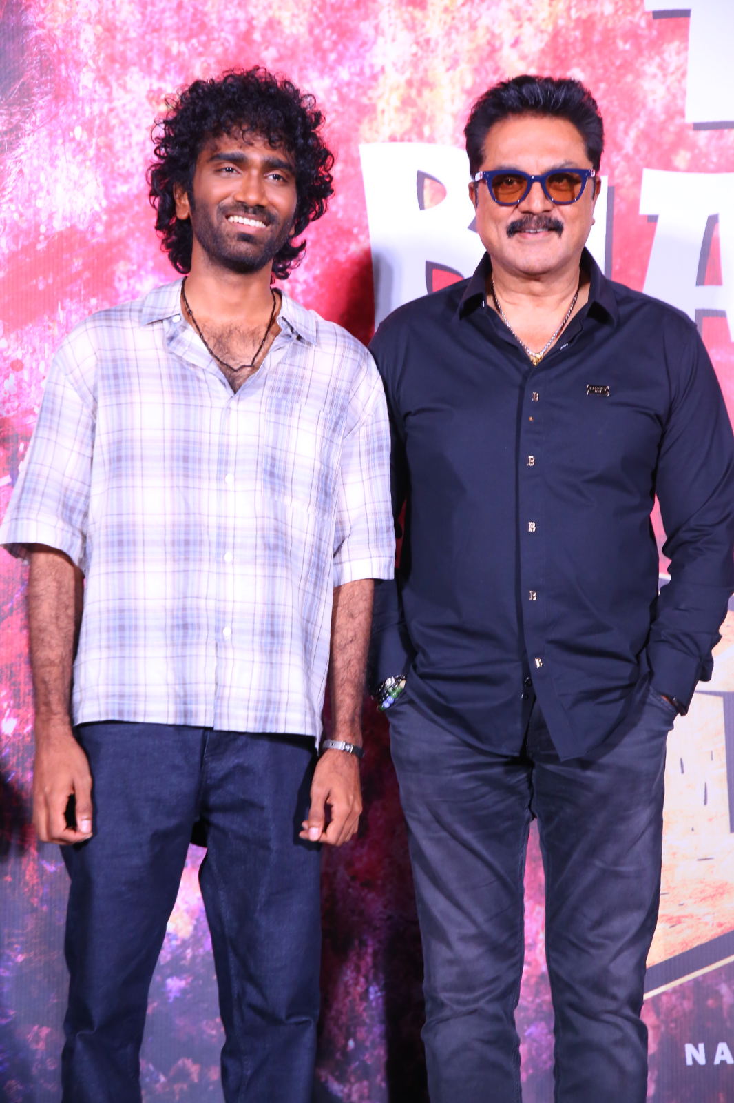 Pradeep Ranganathan and R. Sarath Kumar posing
