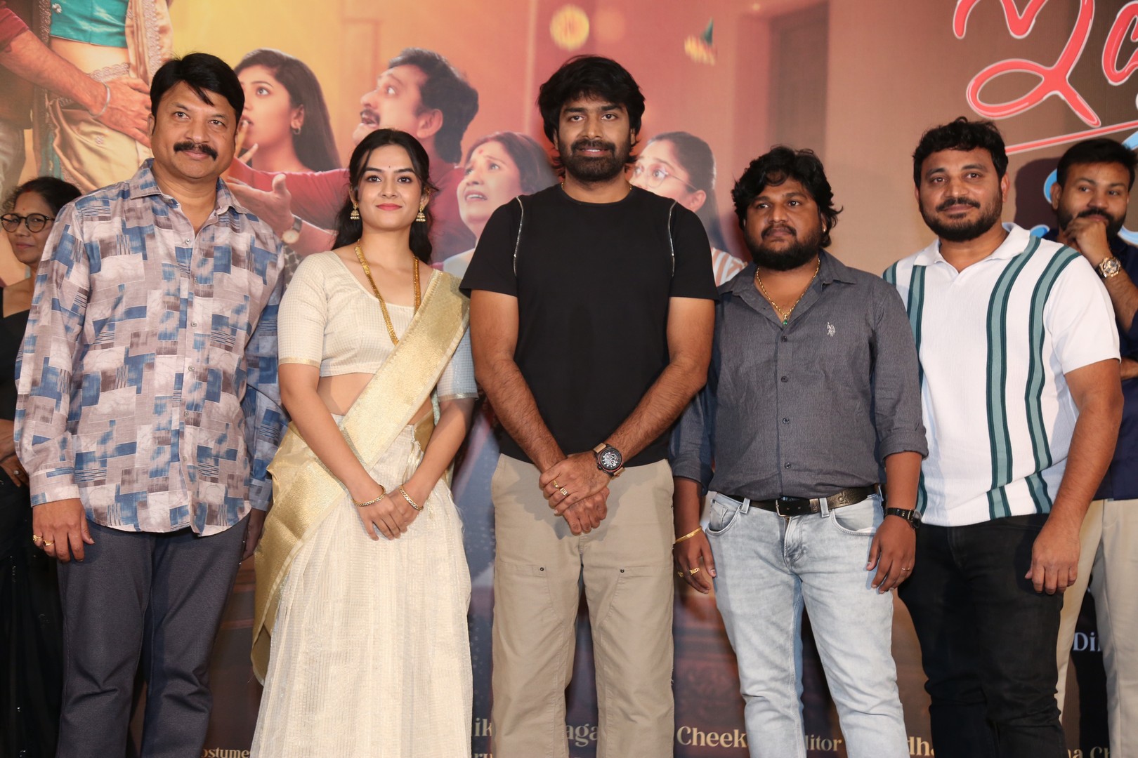 Film crew unveiling trailer on stage at launch event