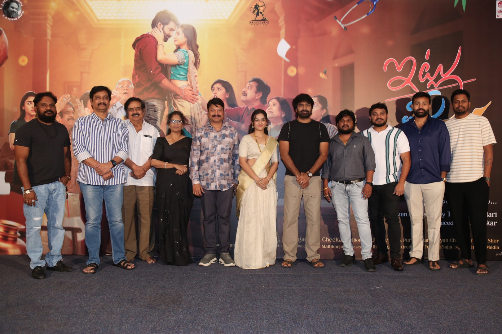 Cast members smiling and interacting during trailer event