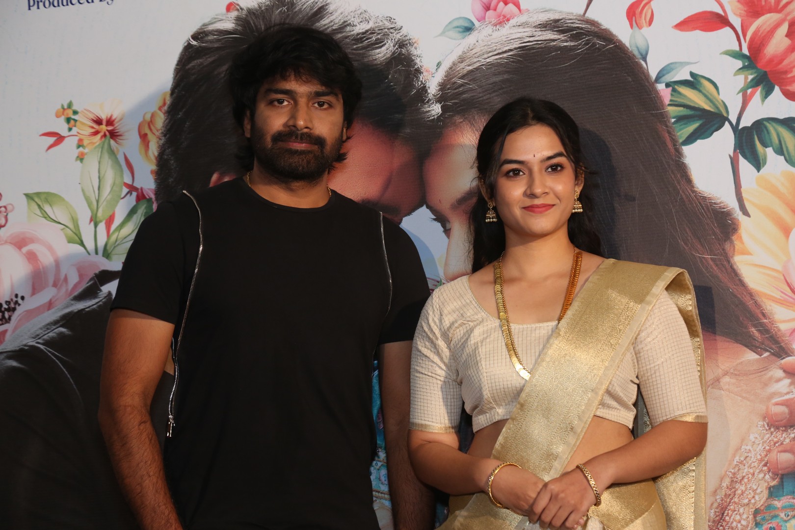 Promotional poster backdrop displayed at launch venue