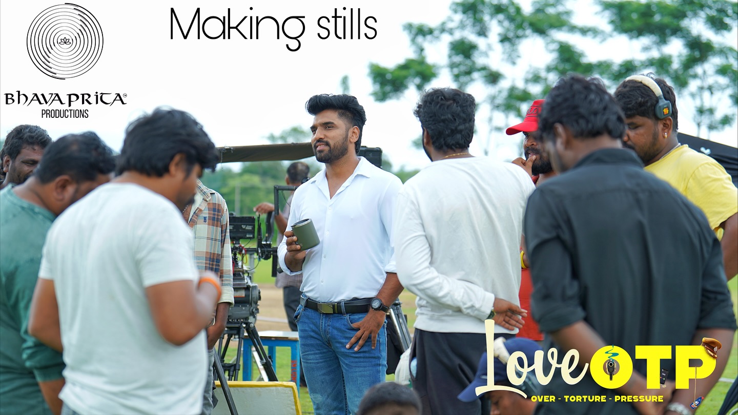 Actor posing with crew members before shoot