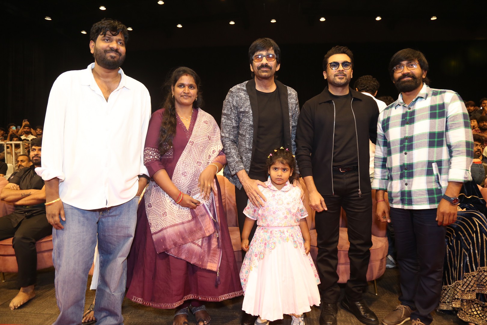 Bhanu Bhogavarapu, Ravi Teja, and Suriya posing for media