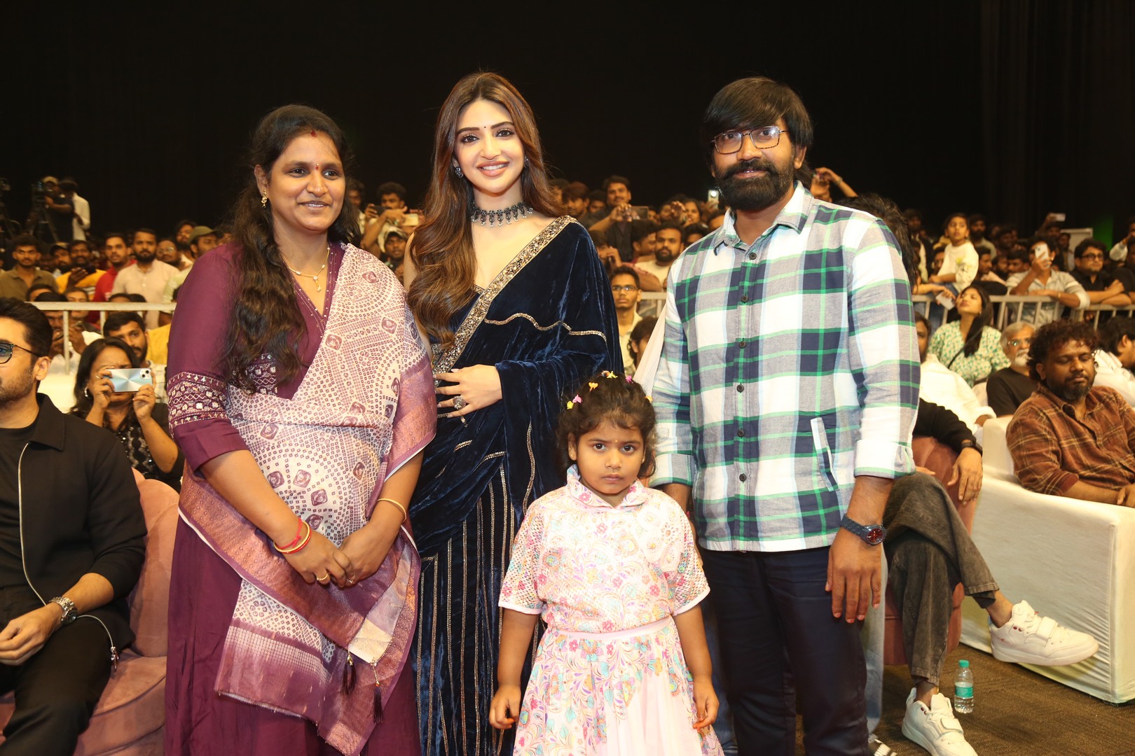 Sreeleela posing gracefully with team for media photos