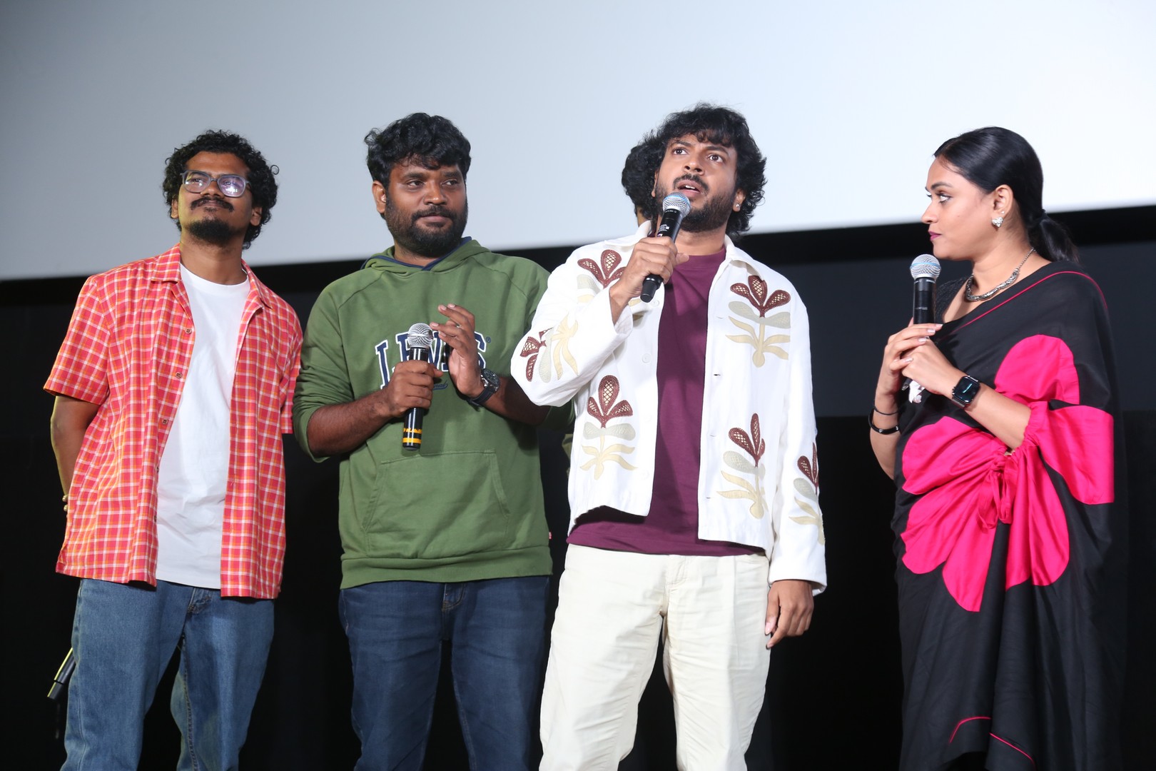 Team delivering speeches during trailer launch